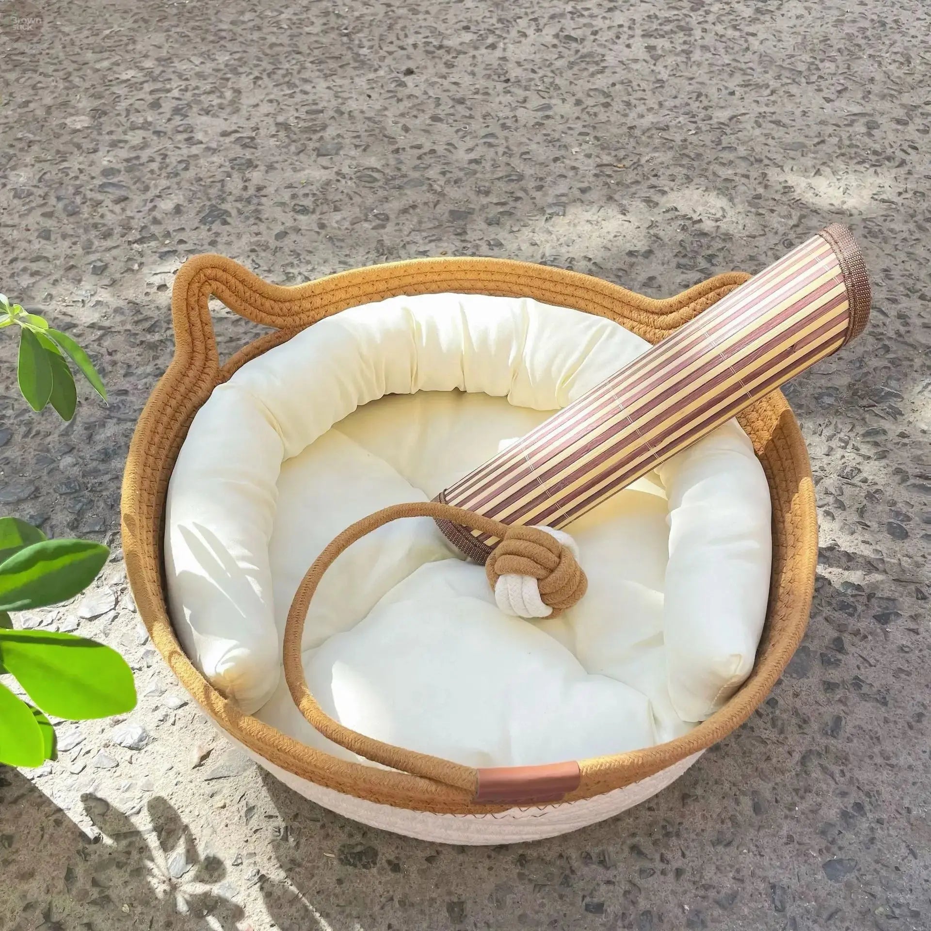A woven cat bed featuring a removable and washable rattan design Brownstick