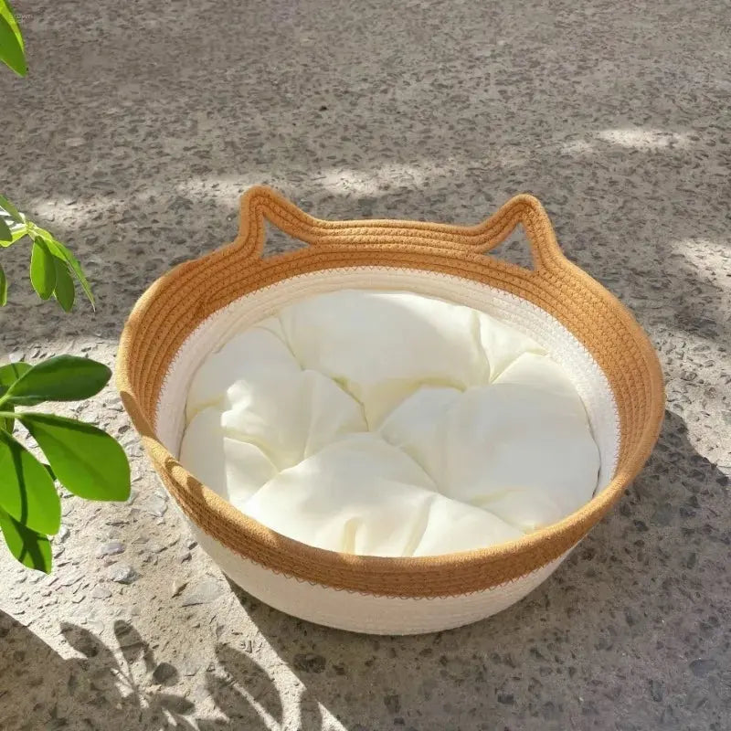 A woven cat bed featuring a removable and washable rattan design Brownstick