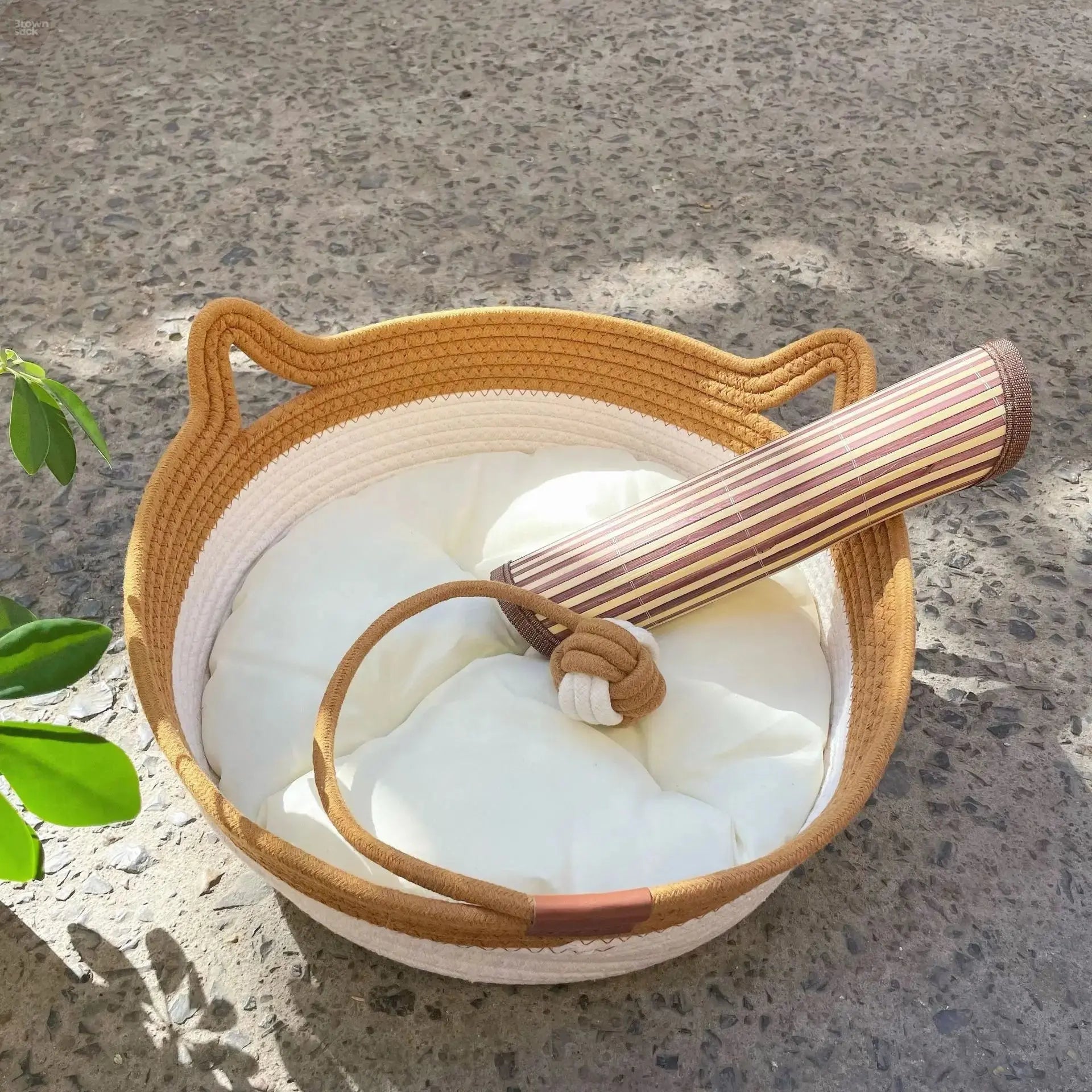 A woven cat bed featuring a removable and washable rattan design Brownstick