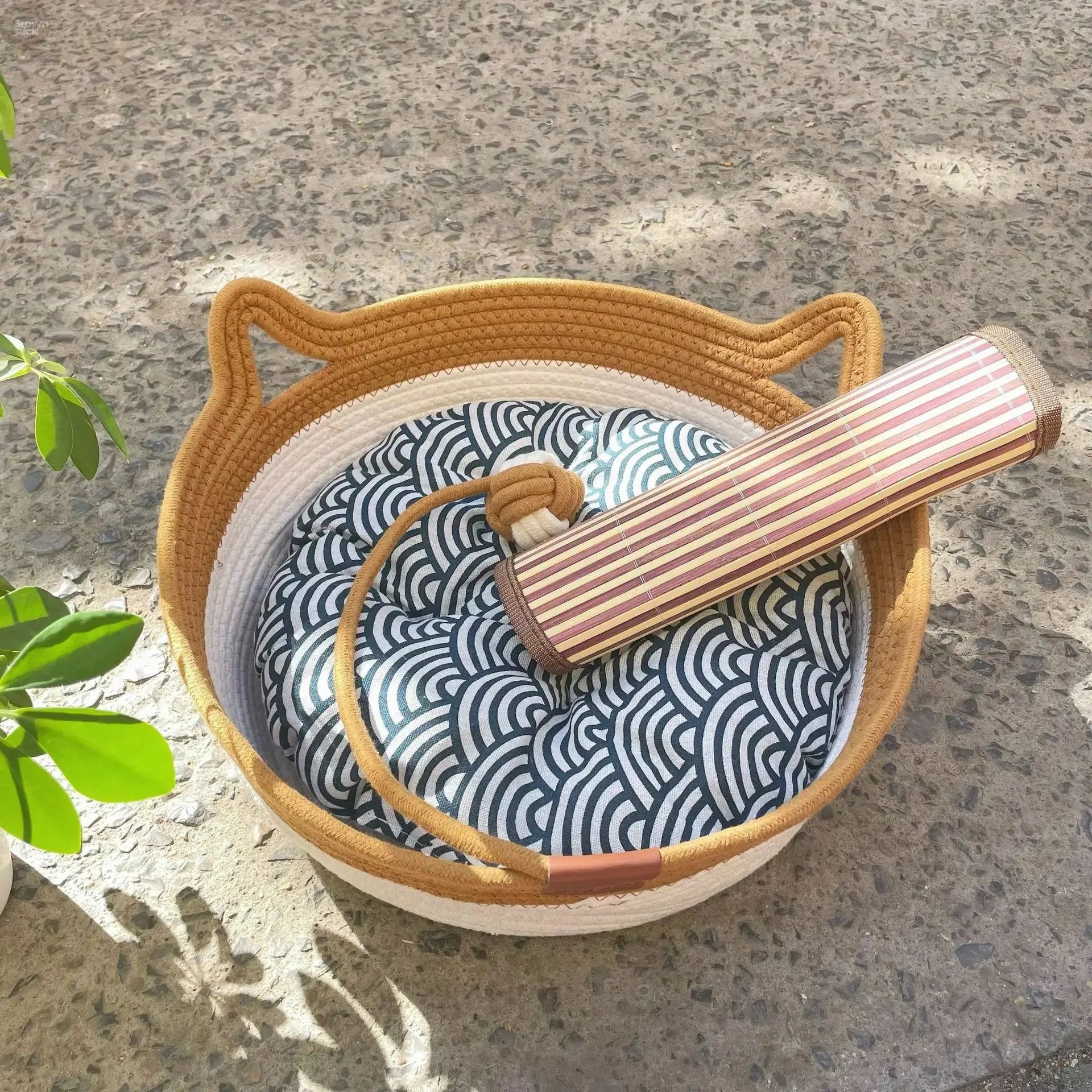 A woven cat bed featuring a removable and washable rattan design Brownstick