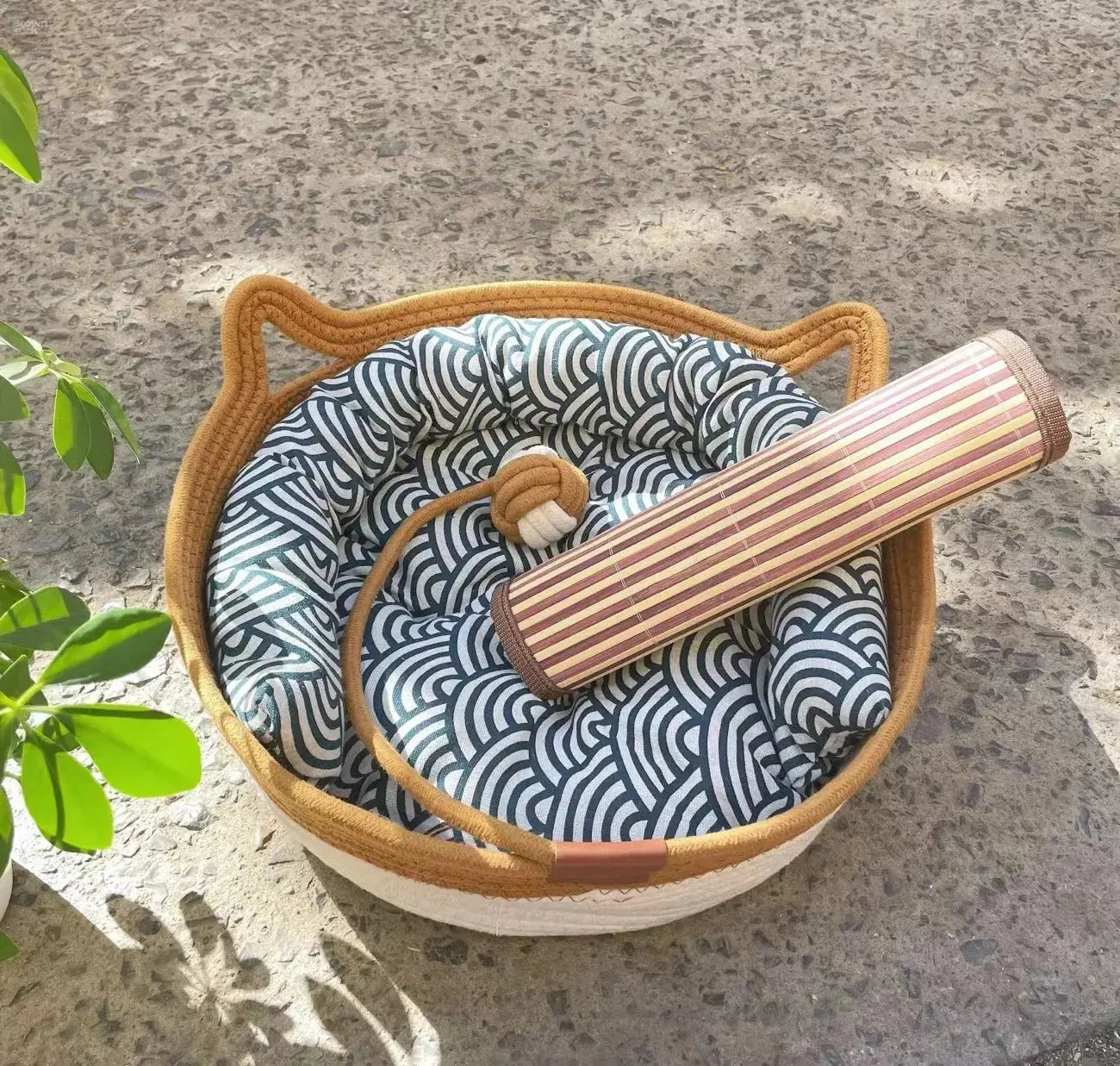 A woven cat bed featuring a removable and washable rattan design Brownstick